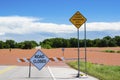 Severe Flooding in Oklahoma in neighborhood with warning sign