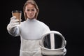 Severe spacewoman is demonstrating espresso