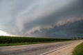 A severe thunderstorm accompanied by a menacing shelf cloud approaches. Royalty Free Stock Photo
