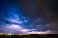 A severe thunderstorm is illuminated by a lightning bolt at night in Lithuania Royalty Free Stock Photo