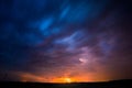 A severe thunderstorm is illuminated by a lightning bolt at night in Lithuania Royalty Free Stock Photo