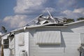 Severely damaged houses after hurricane in Florida mobile home residential area. Consequences of natural disaster