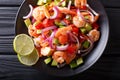 Seviche from marinated shrimp with avocado, pepper, tomatoes and