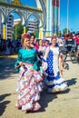 Elegant women in traditional and colorful dress at the April Fair, Seville Fair Feria de Sevilla