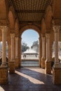 Sevilla, Spain; 01 01 2020: The fountain in Plaza de Espana framed between two rows of columns