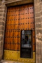 SEVILLE, ANDALUSIA / SPAIN - OCTOBER 13 2017: TRADITIONAL HEAVY WOODEN DOOR