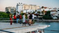 Seville Past View tour tourists using Augmented Reality technology to view Seville's emblematic sites and learn their history in