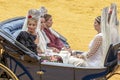 Seville, Spain - April  15, 2018: Women carries the traditional spanish head coverage called mantilla in a Horse drawn carriage in Royalty Free Stock Photo
