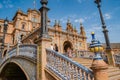 Seville SPAIN - AUGUST 9, 2022 - Tiled bridge and balustrade, stairs in front of facade of palace in Plaza de EspaÃ±a Royalty Free Stock Photo