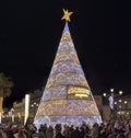 Seville, Spain - December 15, 2018: Christmas tree near Seville Cathedral of Saint Mary of the See Seville Cathedral with a lot Royalty Free Stock Photo