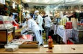 Shopkeepers working while wearing a mask for the coronavirus