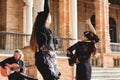 Seville, Spain - Jan 31 2022: A group of flamenco dancers and Spanish guitar player performing in the street Royalty Free Stock Photo