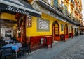 Facade of traditional colourful tapas bar in the historic centre of Seville