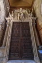 Seville Cathedral, Side wooden old door at Puerta del perdon gate. UNESCO world heritage site