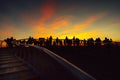 SEVILLE,SPAIN-March 8:Group of people looking at sunset and citycsape in Seville.Andalucia,Spain.Tourists sightseeing,enjoying