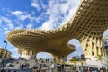 Seville, Spain, March 5, 2022. Las Setas de Sevilla with numerous people resting on the stairs. Metropol parasol.