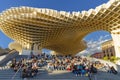 Seville, Spain, March 5, 2022. Las Setas de Sevilla with numerous people resting on the stairs. Metropol parasol.