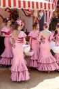 Beautiful andalusian young women dressed in traditional costumes at the Seville`s April Fair. Royalty Free Stock Photo