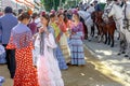 Young Women relaxing and dressed in traditional costumes at the Seville`s April Fair.