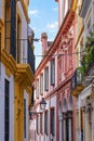 Sevilla in Spain, the narrow buildings of the historic city with beautifully decorated colorful houses and narrow streets of the o