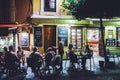 Tourists relaxing at terraces of traditional tapas bars at during in the historic centre of Seville, Andalusia, Spain