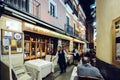 Tourists relaxing at terraces of traditional tapas bars at during in the historic centre of Seville, Andalusia, Spain