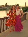 Seville Spain/16th April 2013/ Two beautiful young Spanish ladies walk together to the annual April Spring Fair held in the city