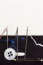 Sew needles, strings, safety pin and buttons - rep Royalty Free Stock Photo