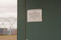 Sewage disposal sign on festival outhouse Royalty Free Stock Photo