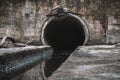 Sewage drainage pipe, sewage flows from the collector. Environmental pollution Royalty Free Stock Photo