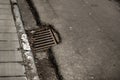 Sewage hole on the road Royalty Free Stock Photo