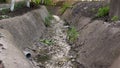 Waste water flow to sewer with bad water from city, water pollution, sewer drain pipe dirt sewage water drain to Wastewater Treatm