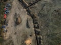 sewer excavations and piles of earth at the construction site