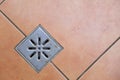 Sewer grate drain water on floor in bathroom Royalty Free Stock Photo