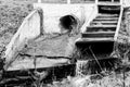 Sewer hole expelling water to the river at a countryside village