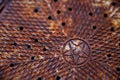 Sewer Man Hole Cover with Rusty Star Design Royalty Free Stock Photo