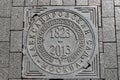 A sewer manhole cover in Alexander garden in Moscow, Russia. Royalty Free Stock Photo