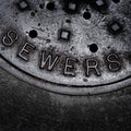 Sewer Manhole cover iron steel access to utility Royalty Free Stock Photo