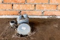 Sewer pipes in home basement. System of gray sanitary pipes in old house Royalty Free Stock Photo