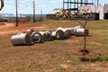 Sewer pipes laid out on the grass waiting to be installed