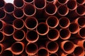 Sewer pipes stacked on shelves. Composition of building materials Royalty Free Stock Photo