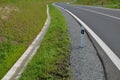 Sewer pipes under the bridge. crossing ditch by side road. concrete hole with stone paving surroundings. The gutter drains around Royalty Free Stock Photo