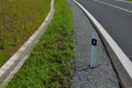 Sewer pipes under the bridge. crossing ditch by side road. concrete hole with stone paving surroundings. The gutter drains around Royalty Free Stock Photo