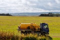 Septic truck on field with grass. Sewage Tank truck. Sewer pumping machine Royalty Free Stock Photo
