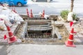 Sewer repair work on the sidewalk.