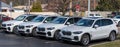 Sewickley, Pennsylvania, USA March 5, 2023 Four new, white BMW SUVs lined for sale at a dealership