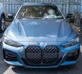 Sewickley, Pennsylvania, USA March 5, 2023 A new, light blue BMW sedan for sale at a dealership