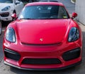 Sewickley, Pennsylvania, USA March 5, 2023 A used, red Porsche coupe for sale at a dealership