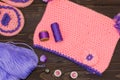 Sewing accessories. Knitted baby cap and Slippers, yarn for knit Royalty Free Stock Photo