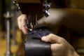 Sewing a Box Stitch on Black Leather Royalty Free Stock Photo
